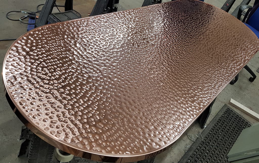 Hand-beaten-copper-table-top - Designs 05 Copper table tops example - A double D end hammered copper top