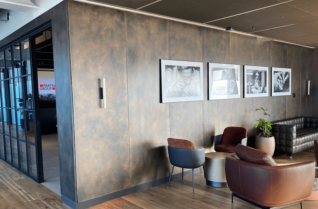 JJ Mack antique brass wall panels - Designs 05 Antique brass wall cladding in a reception area