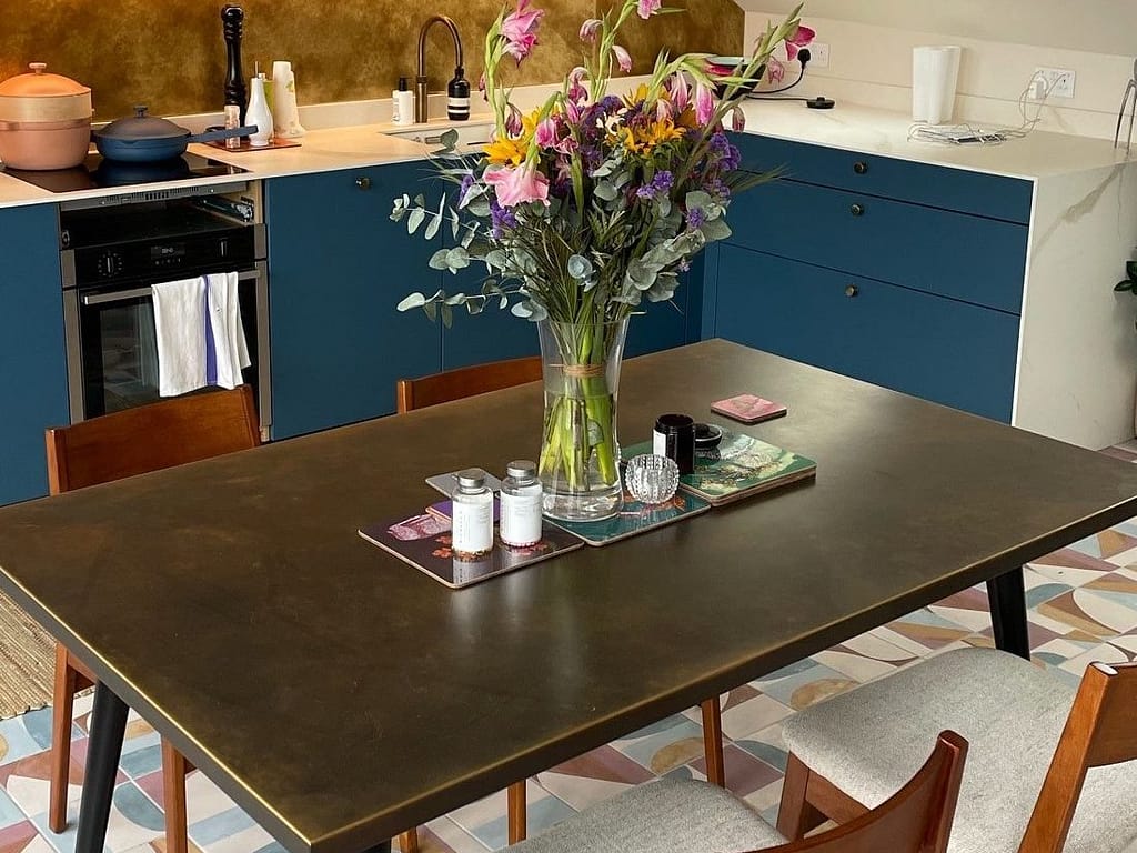 Aged Brass Tabletop & Splashback – Elegant Kitchen Design - Designs 05 Aged brass table top with matching brass splashback in a contemporary kitchen