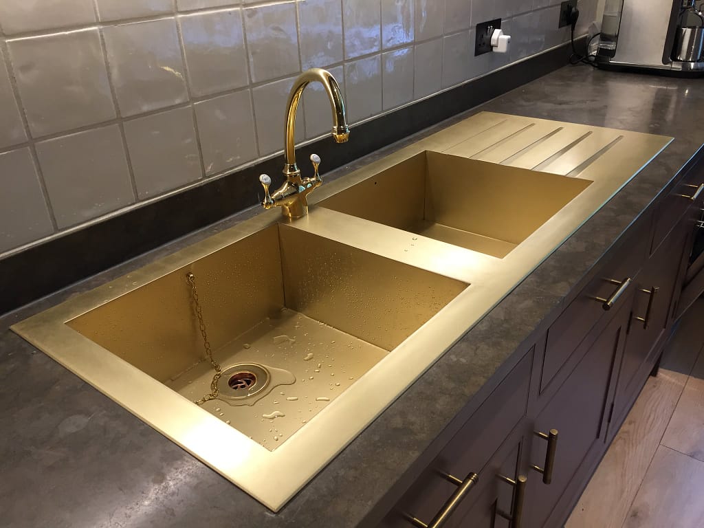 Double Basin Brass Drop-In Sink with Drainer - Designs 05 Double basin brass drop-in sink with integrated drainer in a premium kitchen setting.