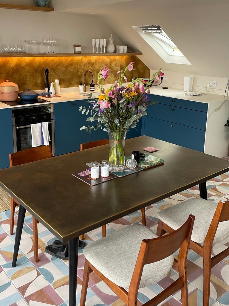 Brass Table Top and Brass Splasback - Designs 05 aged brass table top with matching patina splashback in bespoke kitchen interior.