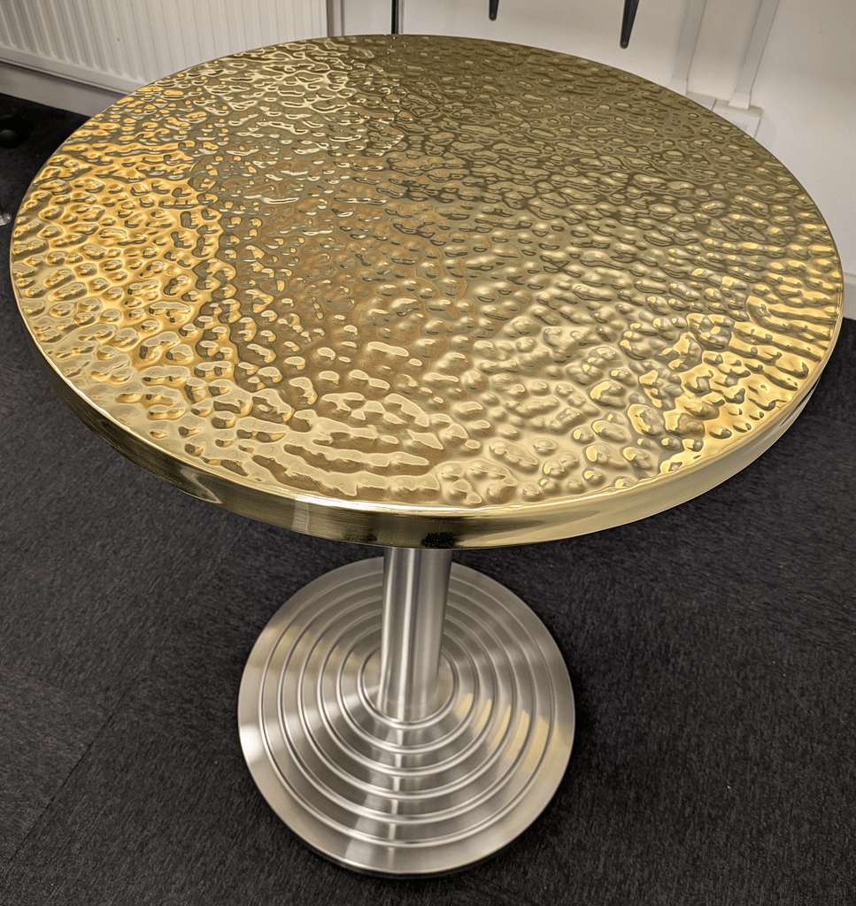 Hammered Brass Restaurant Table - Designs 05 Hammered brass table top used in a boutique restaurant interior